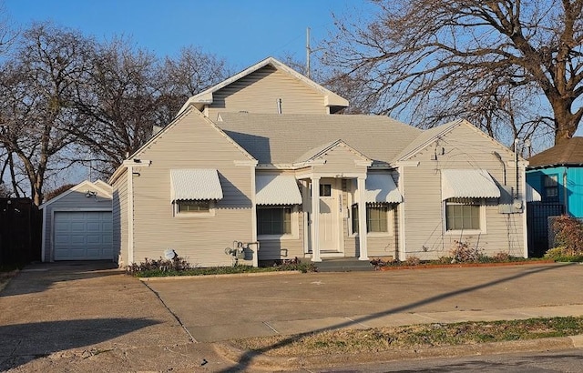 view of front facade with an outbuilding and a garage