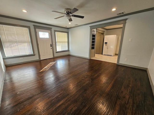 interior space featuring hardwood / wood-style flooring, crown molding, and ceiling fan