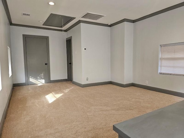 unfurnished room featuring light colored carpet and ornamental molding