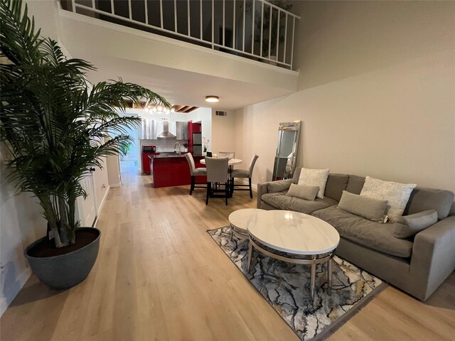 corridor with light hardwood / wood-style flooring