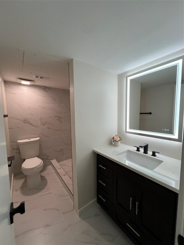 bedroom featuring light hardwood / wood-style flooring and a textured ceiling