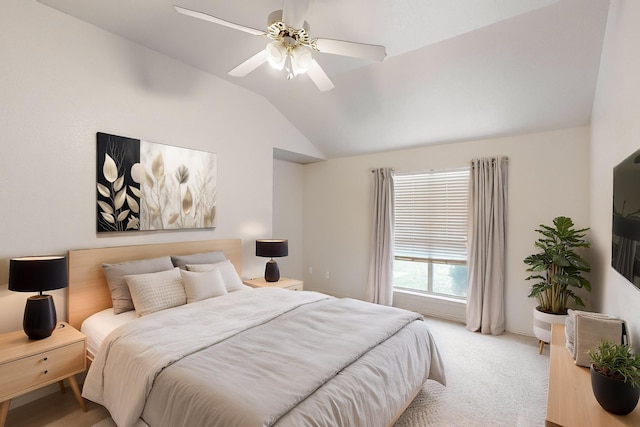 carpeted bedroom with ceiling fan and lofted ceiling