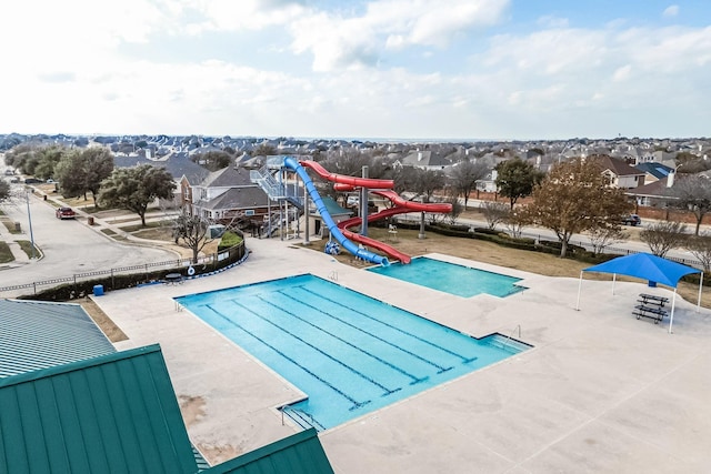 view of pool featuring a playground