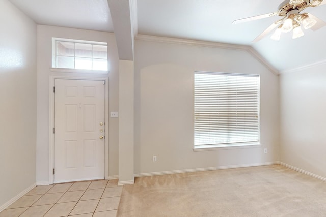 entrance foyer with lofted ceiling, a healthy amount of sunlight, light carpet, and ceiling fan