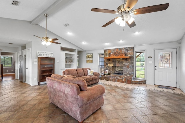 living room featuring built in shelves, ceiling fan, a fireplace, and lofted ceiling with beams