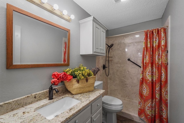 bathroom with walk in shower, vanity, toilet, and a textured ceiling