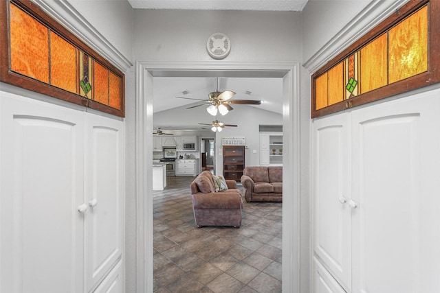 entrance foyer with vaulted ceiling and ceiling fan