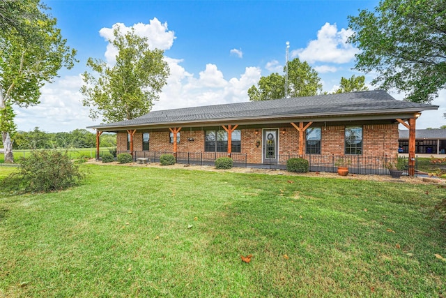 ranch-style home with a front lawn