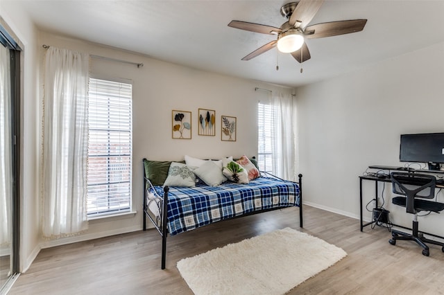 bedroom featuring ceiling fan and light hardwood / wood-style floors