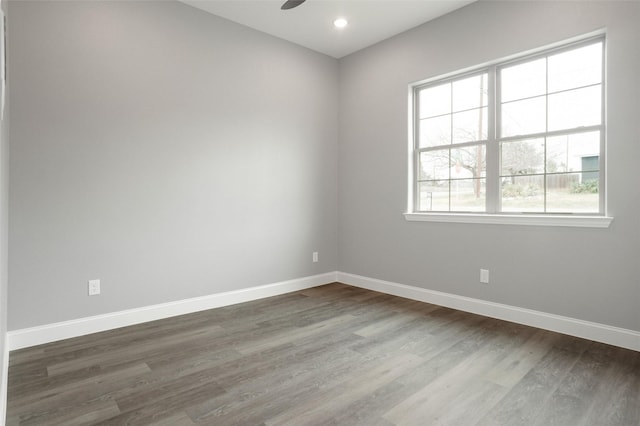 spare room featuring hardwood / wood-style flooring and ceiling fan