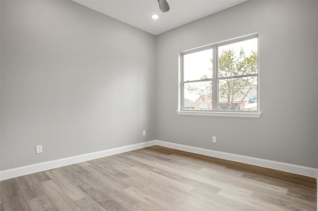 unfurnished room featuring light hardwood / wood-style floors and ceiling fan