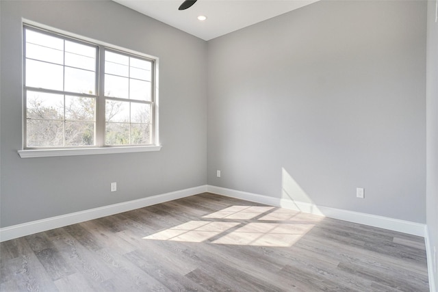 empty room featuring ceiling fan and light wood-type flooring