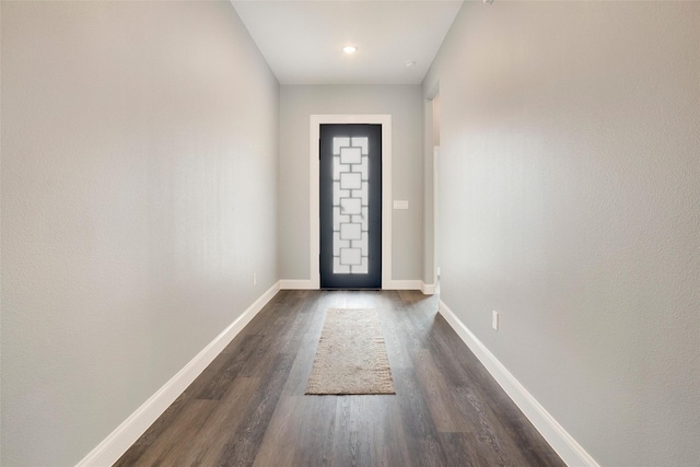 doorway to outside with dark hardwood / wood-style floors