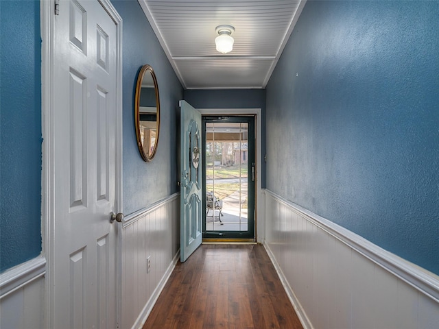 entryway featuring crown molding and dark hardwood / wood-style floors