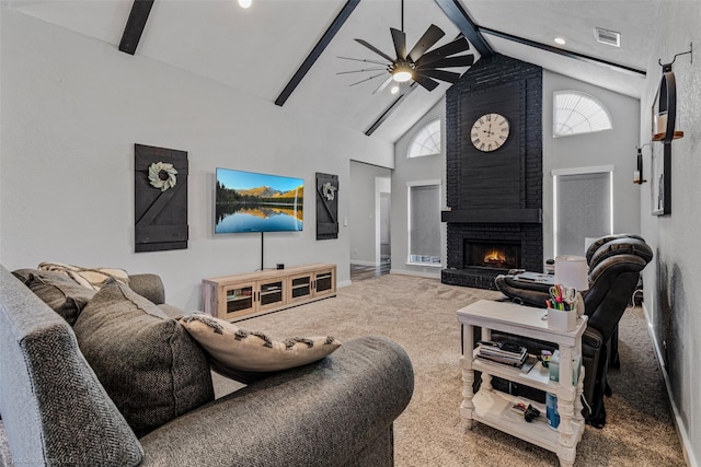 living room featuring ceiling fan, high vaulted ceiling, carpet, a fireplace, and beamed ceiling