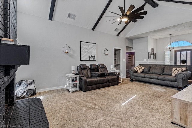 carpeted living room with ceiling fan with notable chandelier, beam ceiling, high vaulted ceiling, a fireplace, and built in shelves