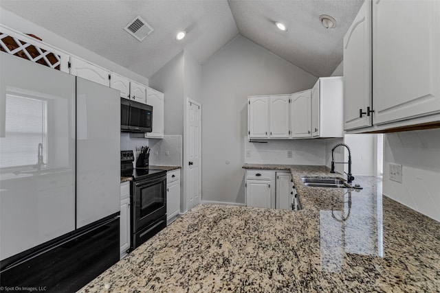 kitchen with white cabinetry, black range with electric cooktop, sink, and dark stone counters