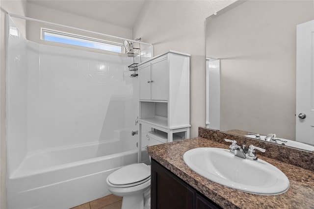 full bathroom featuring shower / bathing tub combination, vanity, tile patterned flooring, and toilet