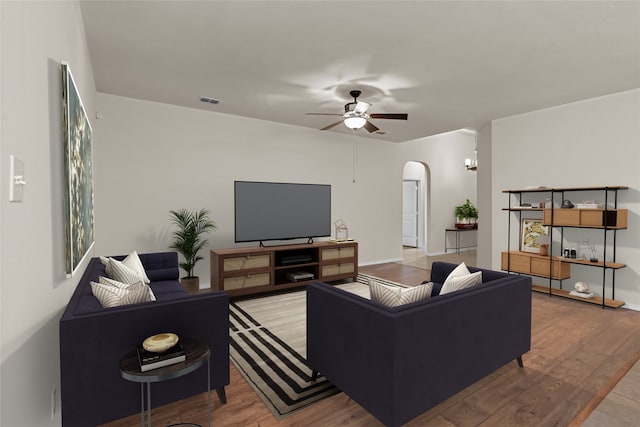 living room featuring hardwood / wood-style flooring and ceiling fan