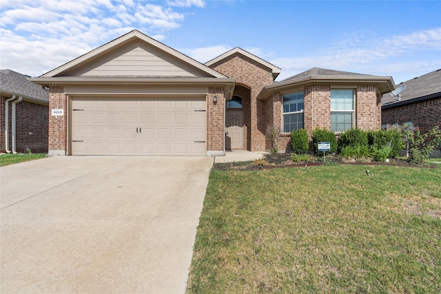 ranch-style house featuring a garage and a front yard