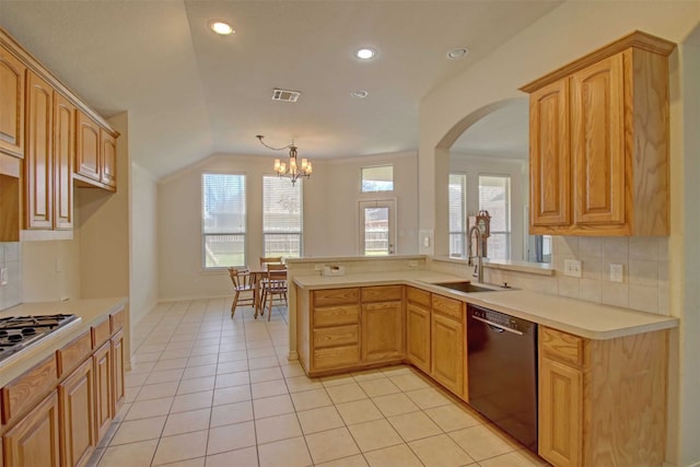 kitchen with light tile patterned flooring, decorative light fixtures, lofted ceiling, black dishwasher, and sink