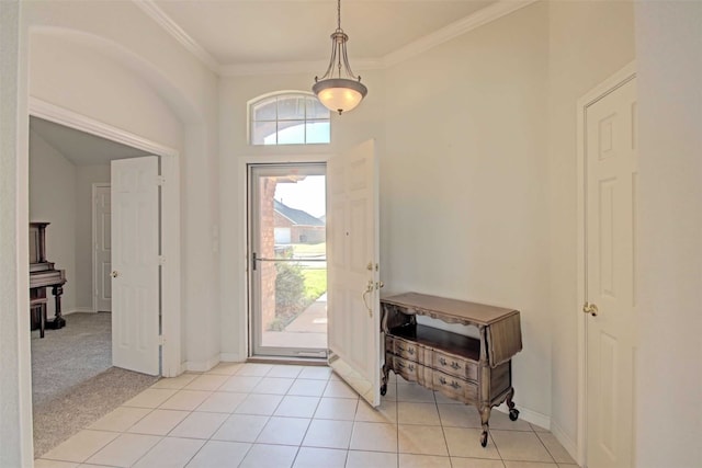 tiled entrance foyer featuring ornamental molding