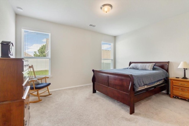 bedroom with light colored carpet