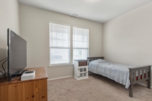 bedroom with light colored carpet