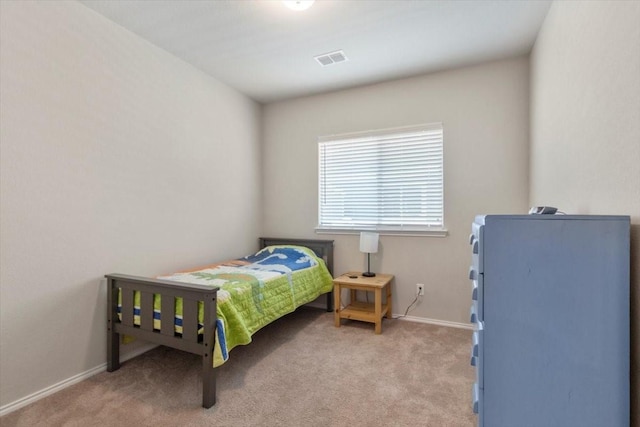 bedroom with light colored carpet