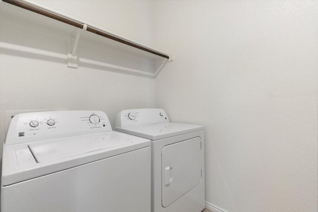 laundry area with independent washer and dryer