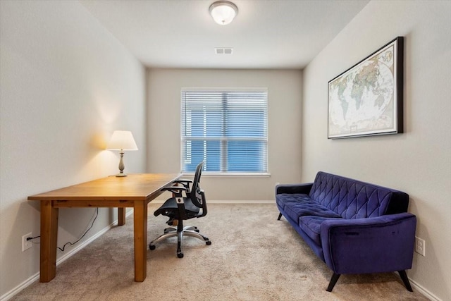 office space with light colored carpet