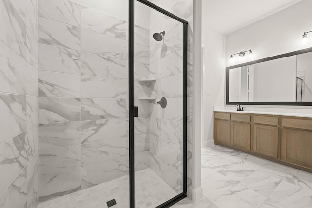 full bathroom with marble finish floor, a marble finish shower, and vanity