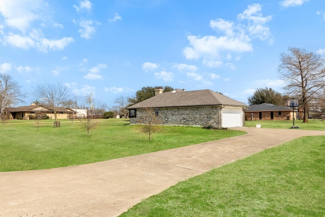 view of property exterior with a yard and a garage