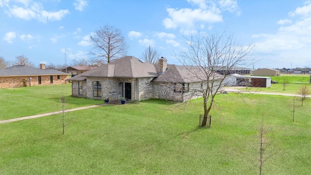 ranch-style house featuring a front yard