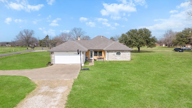 ranch-style home featuring a garage and a front lawn