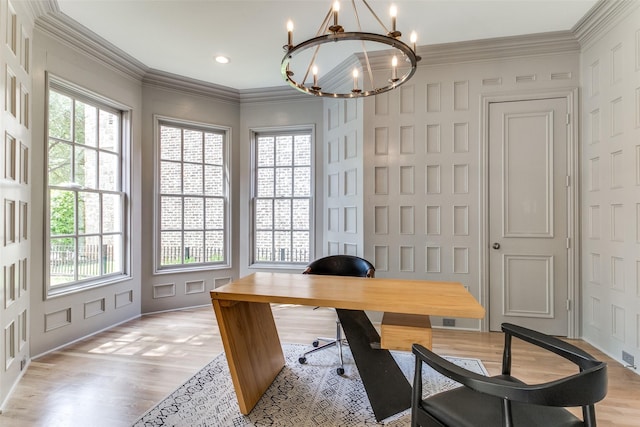 office area with ornamental molding, plenty of natural light, and light hardwood / wood-style flooring