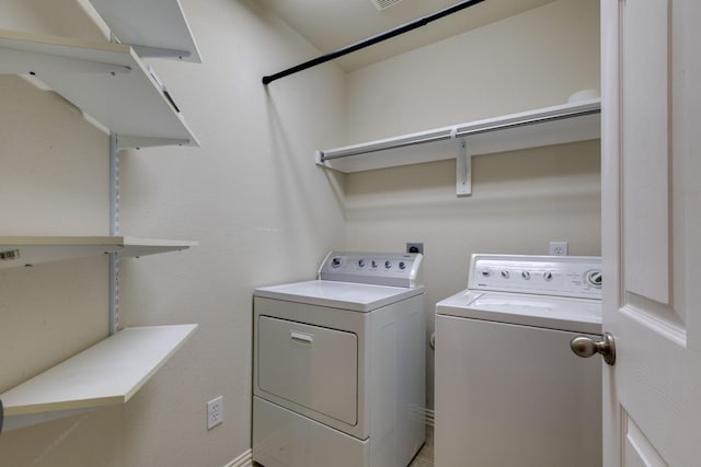 laundry room with washer and dryer and laundry area