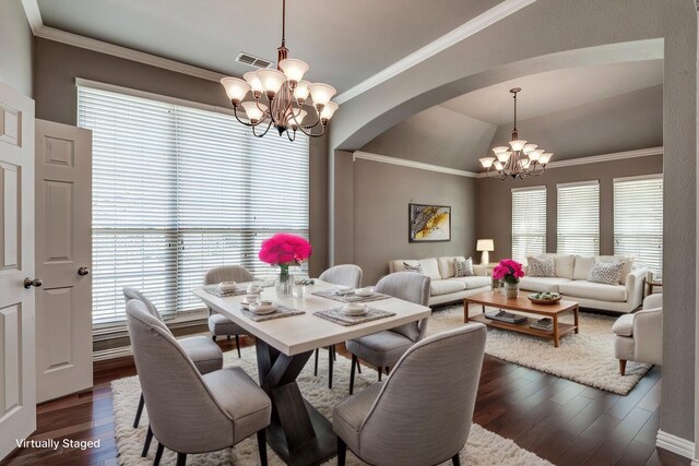 foyer featuring a notable chandelier, crown molding, and light tile patterned flooring