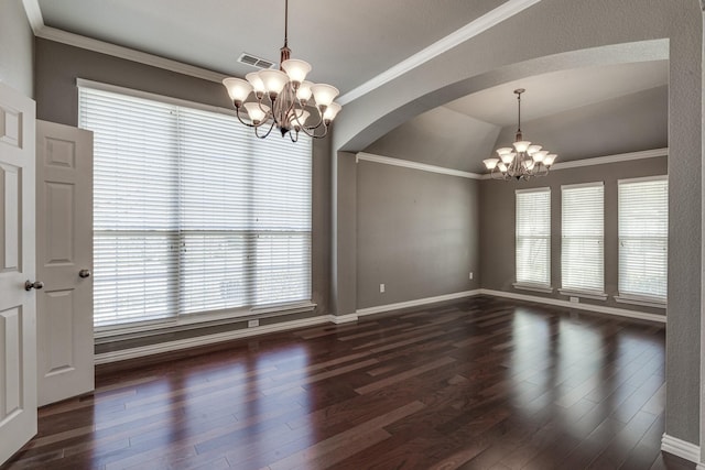 empty room featuring visible vents, a notable chandelier, ornamental molding, and dark wood finished floors