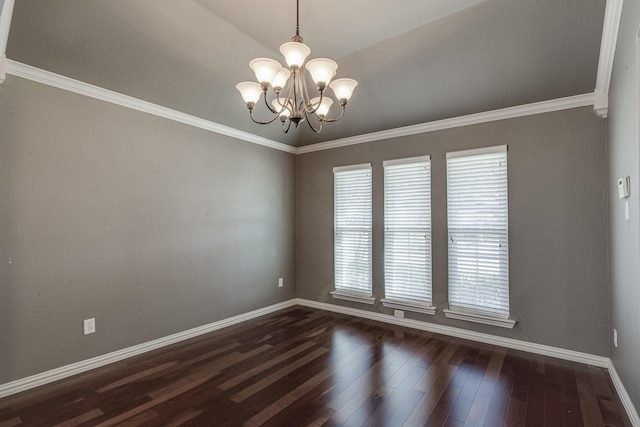 spare room with crown molding, a chandelier, and dark hardwood / wood-style flooring