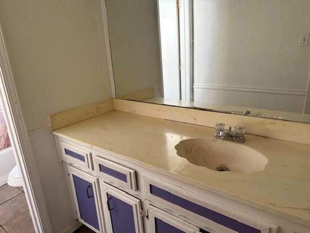 bathroom featuring vanity and tile patterned flooring