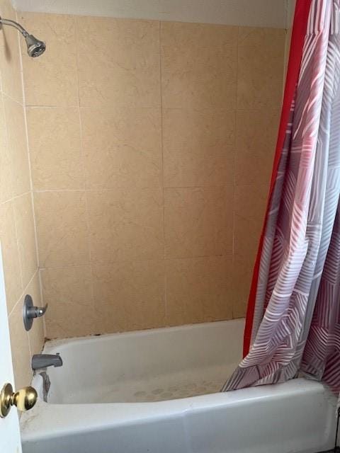 bathroom featuring shower / bath combination with curtain