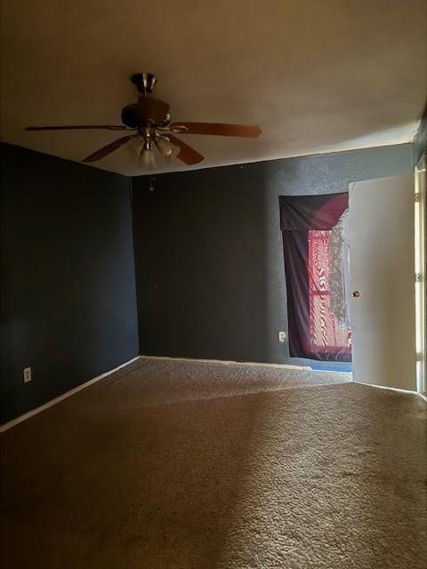 carpeted empty room with ceiling fan