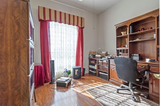 home office with light wood-type flooring