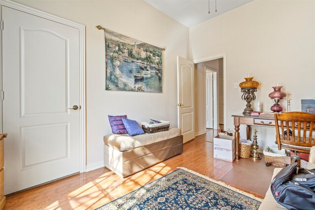 living area with hardwood / wood-style floors