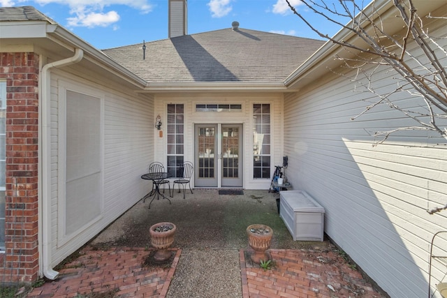 view of exterior entry featuring a patio