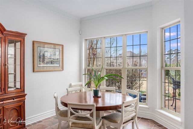 tiled dining space featuring crown molding