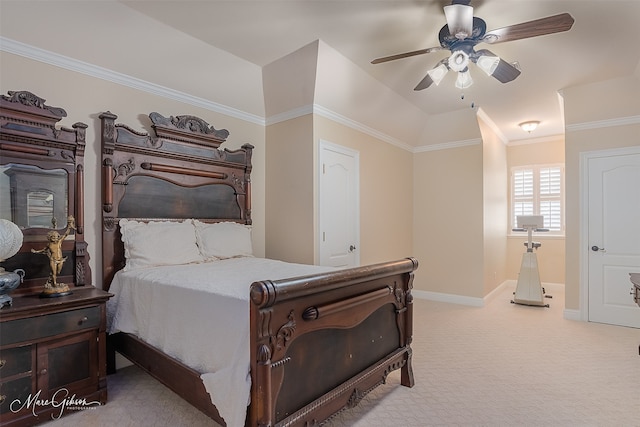 carpeted bedroom featuring ornamental molding, vaulted ceiling, and ceiling fan