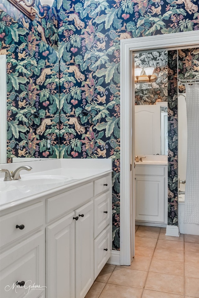 bathroom with tile patterned floors and vanity