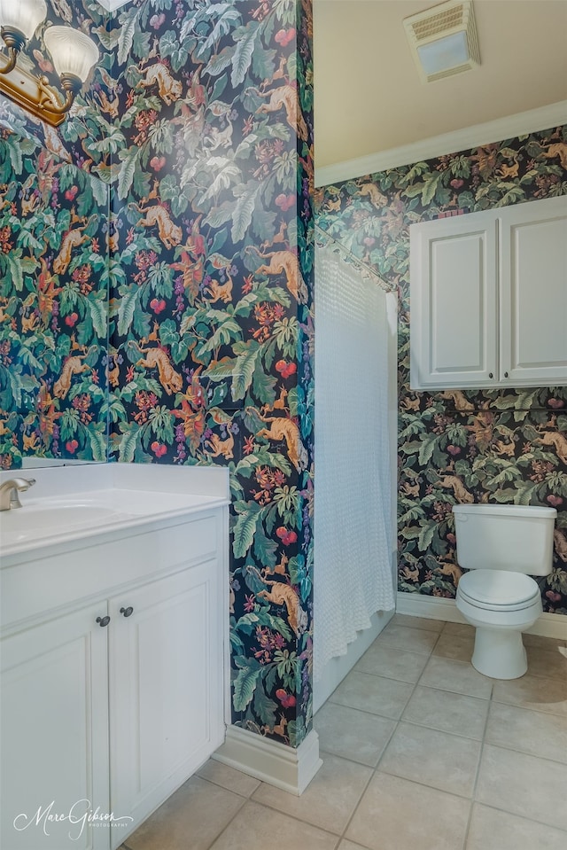 bathroom featuring tile patterned flooring, sink, and toilet